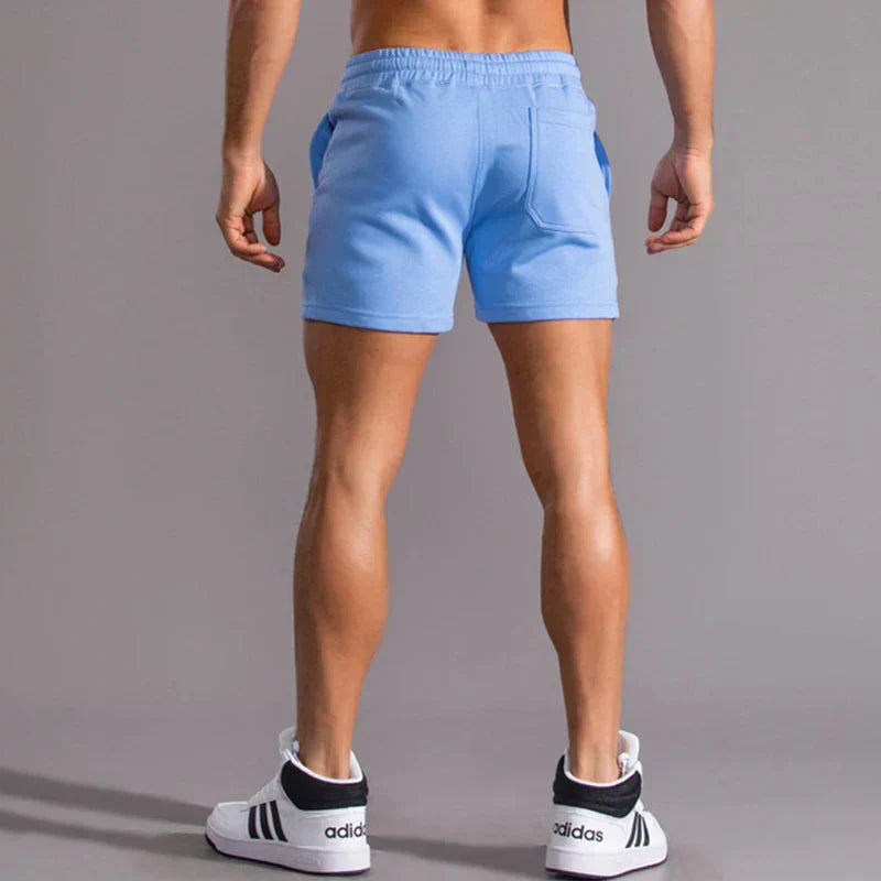 Lässige Herren Slim-Fit Shorts in Blau, moderne Passform, atmungsaktiv, mit Taschen, für Sommeranlässe ideal.