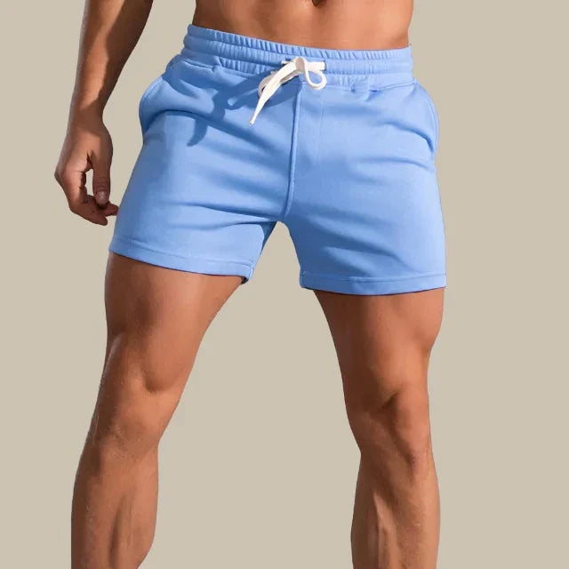 Lässige Herren Slim-Fit Shorts in Blau, moderne Passform, atmungsaktiv, mit Taschen, für Sommeranlässe ideal.