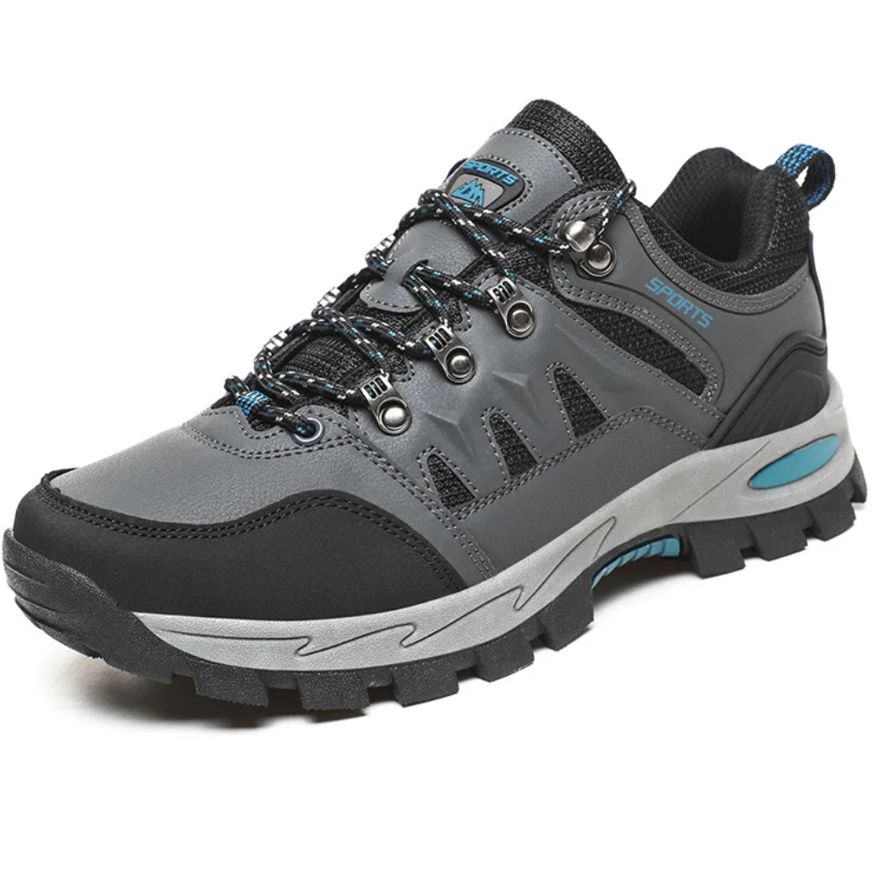 "Leichte graue Outdoor-Wanderschuhe in Seitenansicht für Damen, ideal für Trekking und Abenteurer."