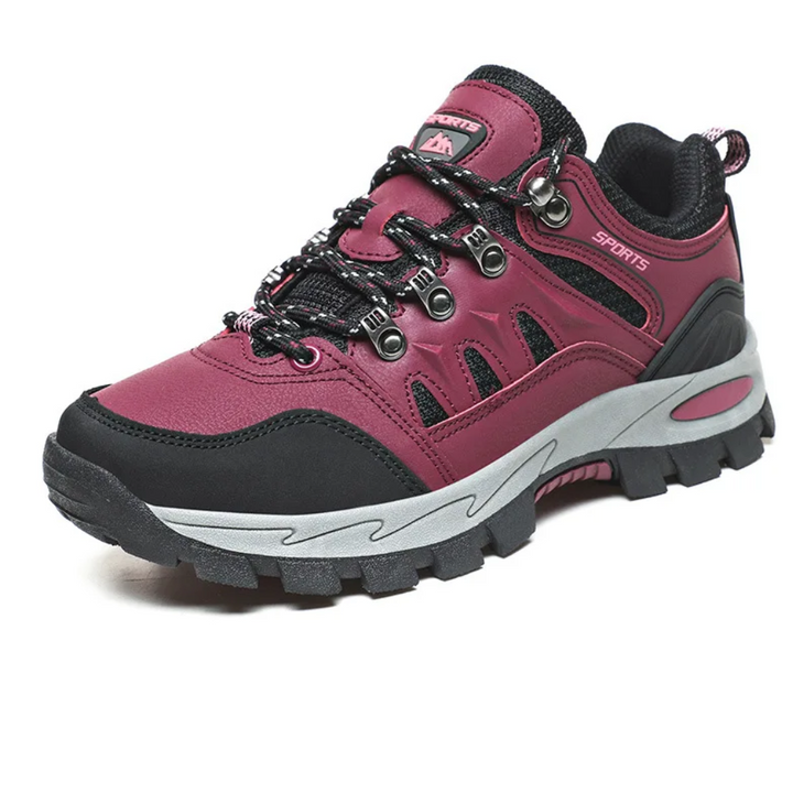 "Leichte graue Outdoor-Wanderschuhe in Seitenansicht für Damen, ideal für Trekking und Abenteurer."
