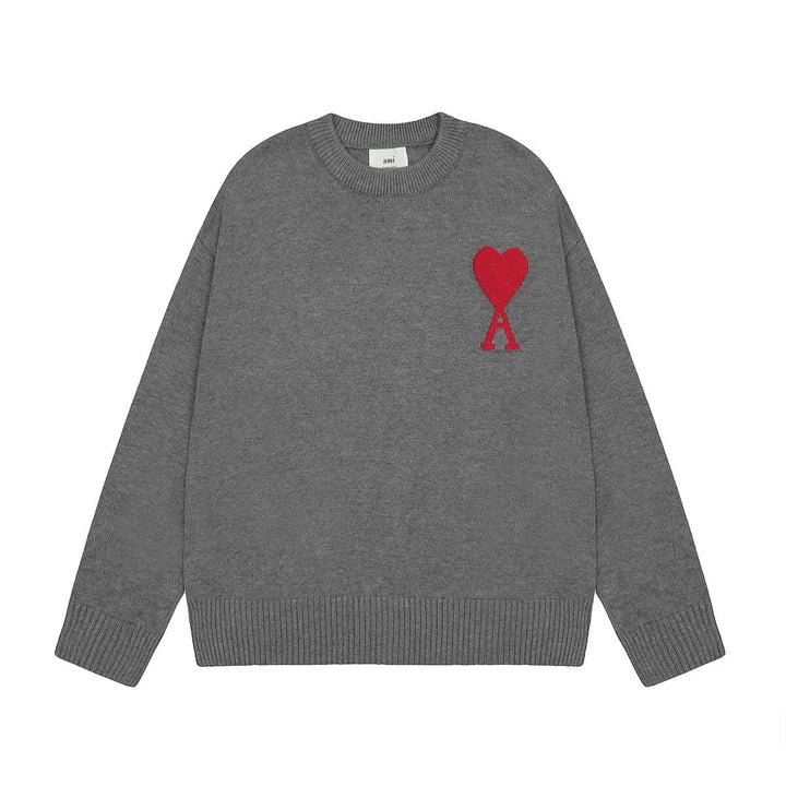 Luxus Unisex-Pullover in Grau mit Herz-Design aus 100% Wolle, edel und komfortabel, zentral platziertes ikonisches Herz.