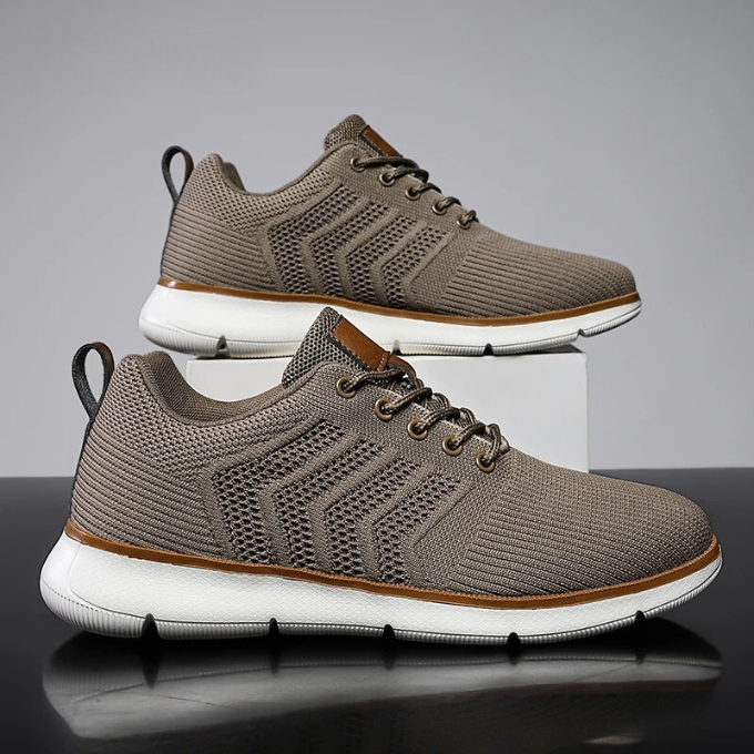 "Moderne Herren Sneaker mit Mesh-Design, atmungsaktiv, schwarz-weiß, ideal für Sport und Freizeit, hohe Komfortdämpfung"