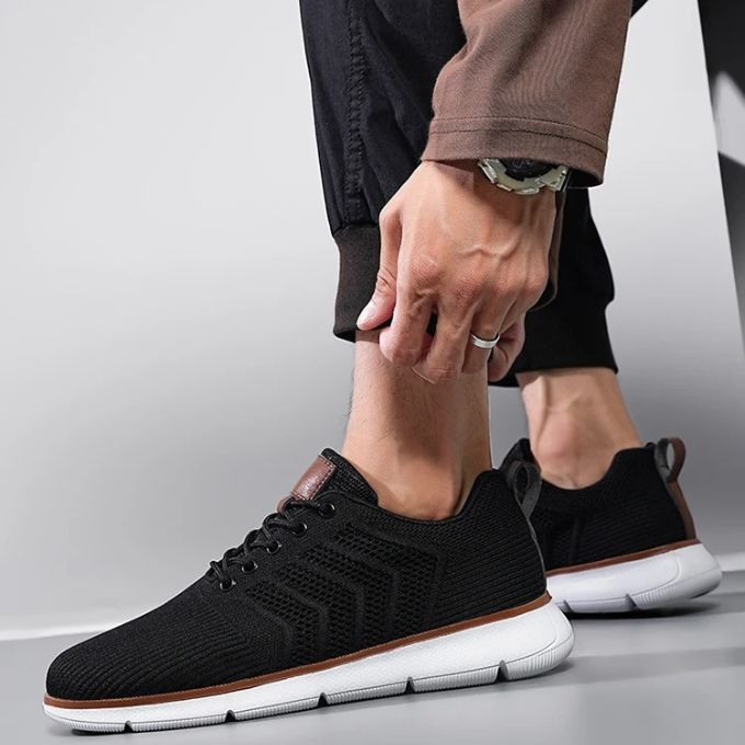 "Moderne Herren Sneaker mit Mesh-Design, atmungsaktiv, schwarz-weiß, ideal für Sport und Freizeit, hohe Komfortdämpfung"