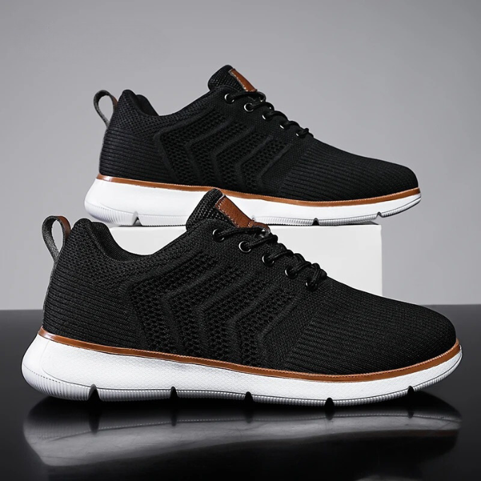 "Moderne Herren Sneaker mit Mesh-Design, atmungsaktiv, schwarz-weiß, ideal für Sport und Freizeit, hohe Komfortdämpfung"