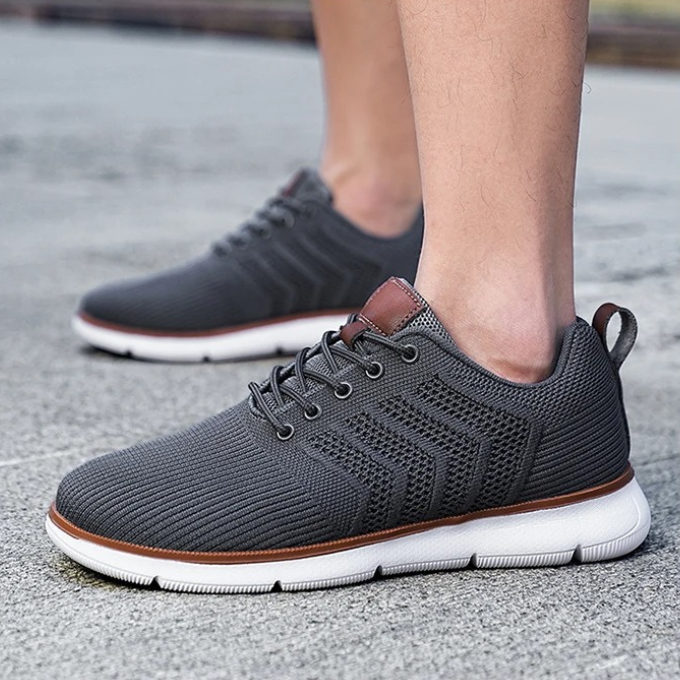 "Moderne Herren Sneaker mit Mesh-Design, atmungsaktiv, schwarz-weiß, ideal für Sport und Freizeit, hohe Komfortdämpfung"