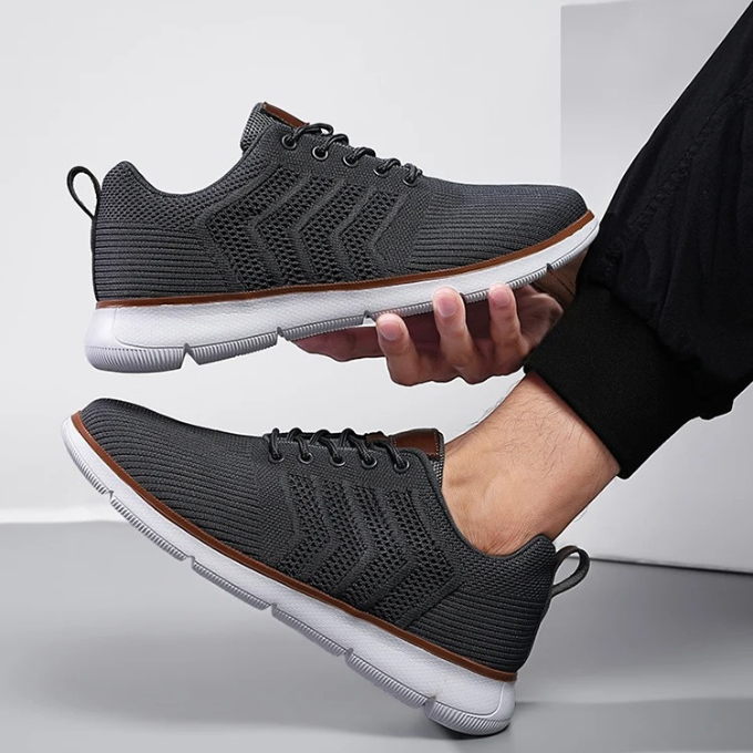 "Moderne Herren Sneaker mit Mesh-Design, atmungsaktiv, schwarz-weiß, ideal für Sport und Freizeit, hohe Komfortdämpfung"