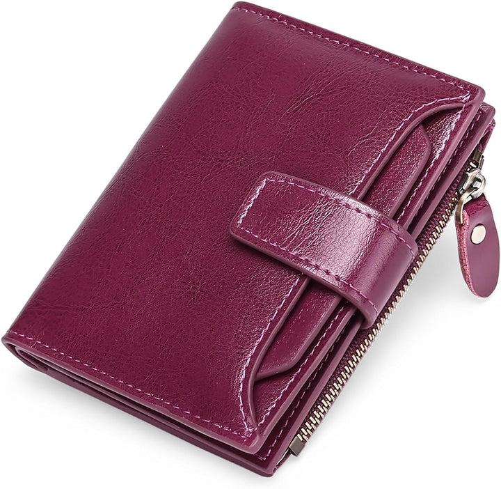 Lila Damen-Geldbörse aus Leder mit Reißverschluss und Druckknopf, elegant und kompakt.