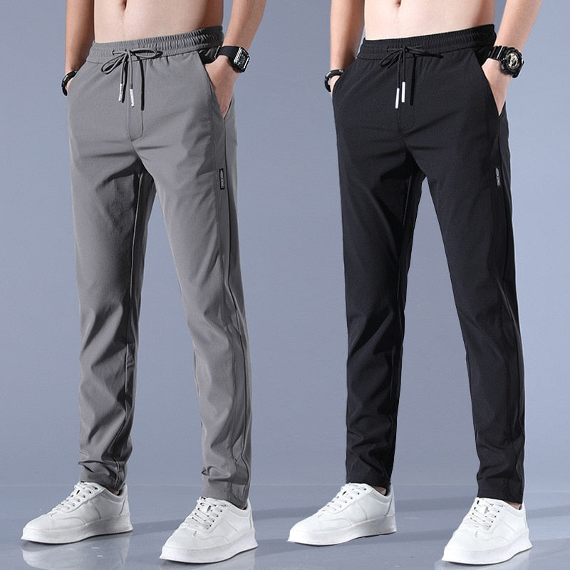 "Schnelltrocknende Herren-Stretchhose mit elastischem Material in Grau, ideal für aktive Männer, modernes Design, atmungsakti