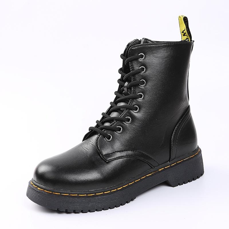 Schwarz-weiße orthopädische Damenstiefel, elegant und funktional, seitliche Ansicht.