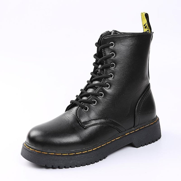 Schwarz-weiße orthopädische Damenstiefel, elegant und funktional, seitliche Ansicht.