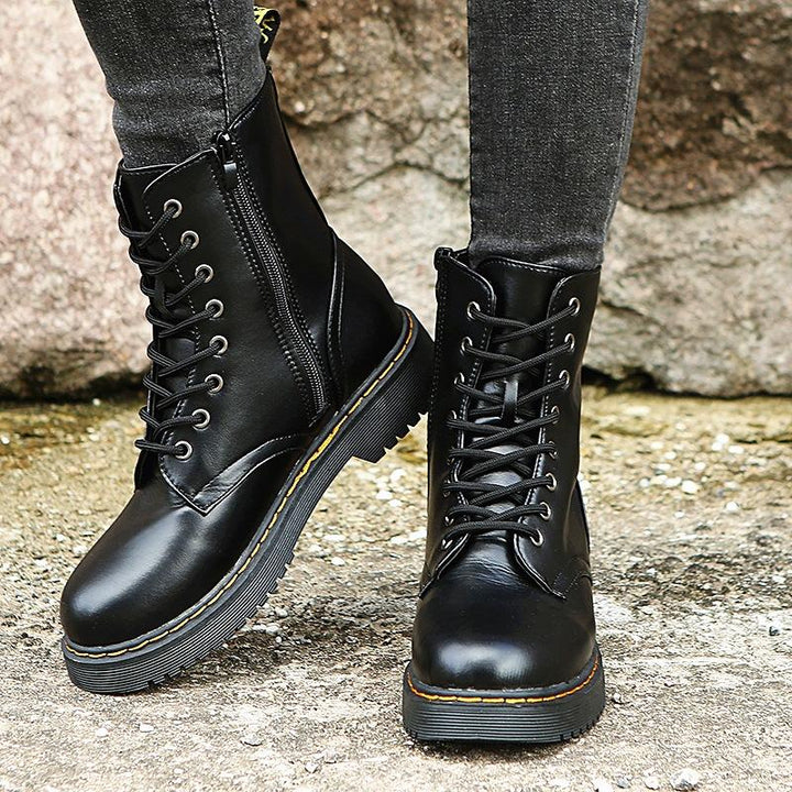 Schwarz-weiße orthopädische Damenstiefel, elegant und funktional, seitliche Ansicht.