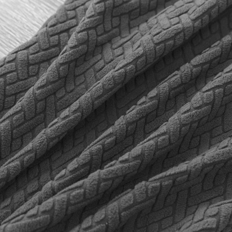 "SofaStyle Premium Sofabezug in Dunkelgrau, elastisch, passt auf alle Sofa-Typen, schützt vor Flecken und Kratzern."