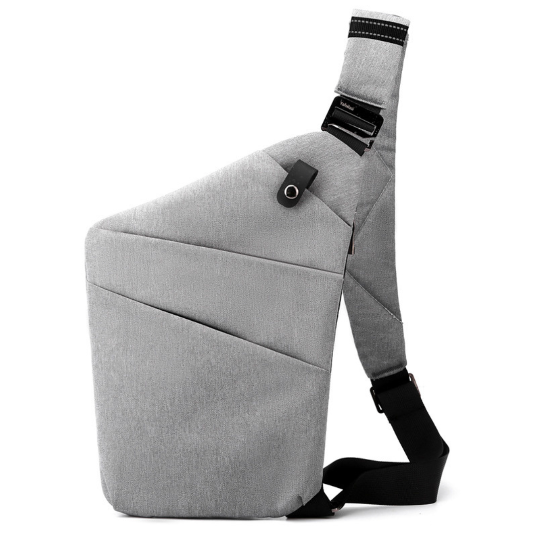 "Stilvolle Anti-Diebstahl Umhängetasche für Damen, elegant in Dunkelgrau mit versteckten Fächern und verstellbarem Riemen."