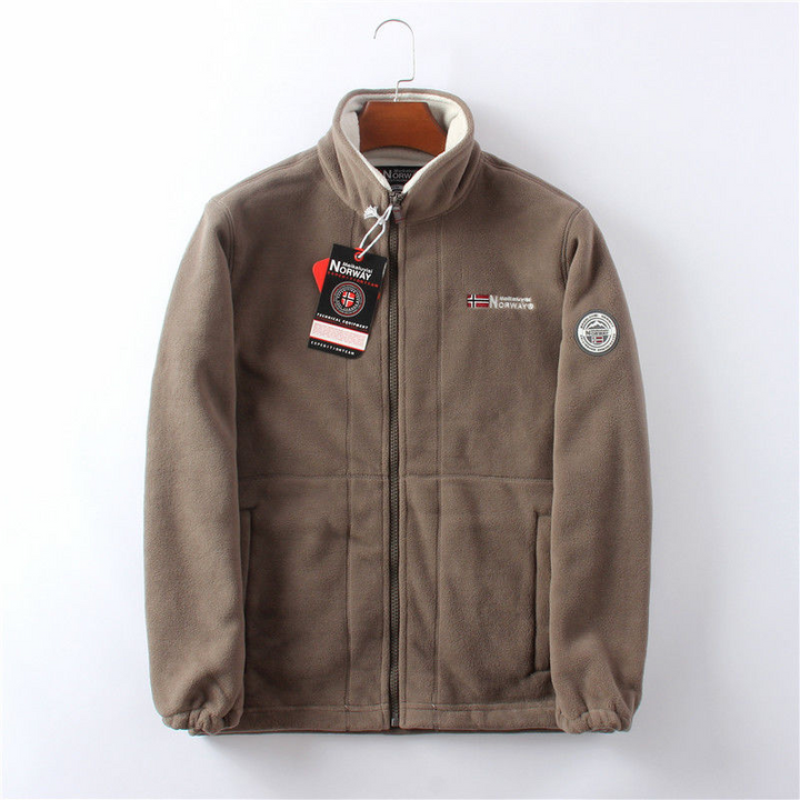 Winddichte Herren Fleece Jacke, grau, elegant, atmungsaktiv, mit versteckten Taschen, ideal für kalte Herbst- und Wintertage.