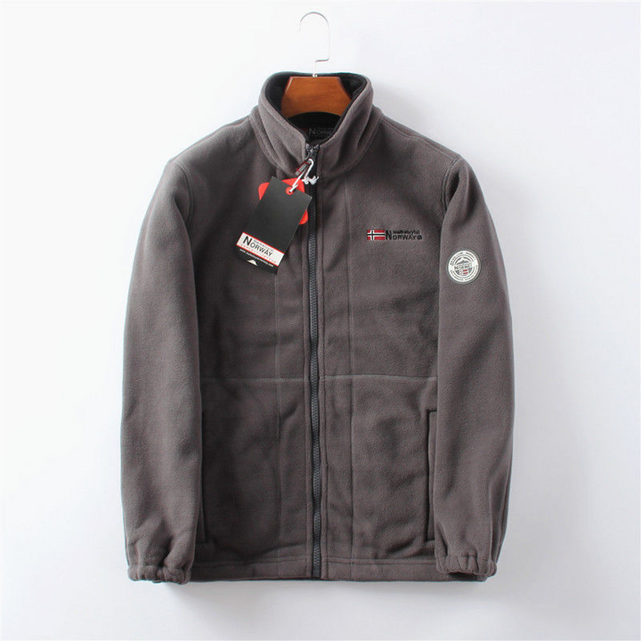 Winddichte Herren Fleece Jacke, grau, elegant, atmungsaktiv, mit versteckten Taschen, ideal für kalte Herbst- und Wintertage.