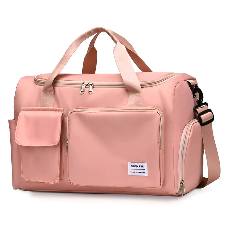 Rosa Reisetasche mit Schultergurt, Reißverschlusstaschen, ideal für Reisen und Sport.